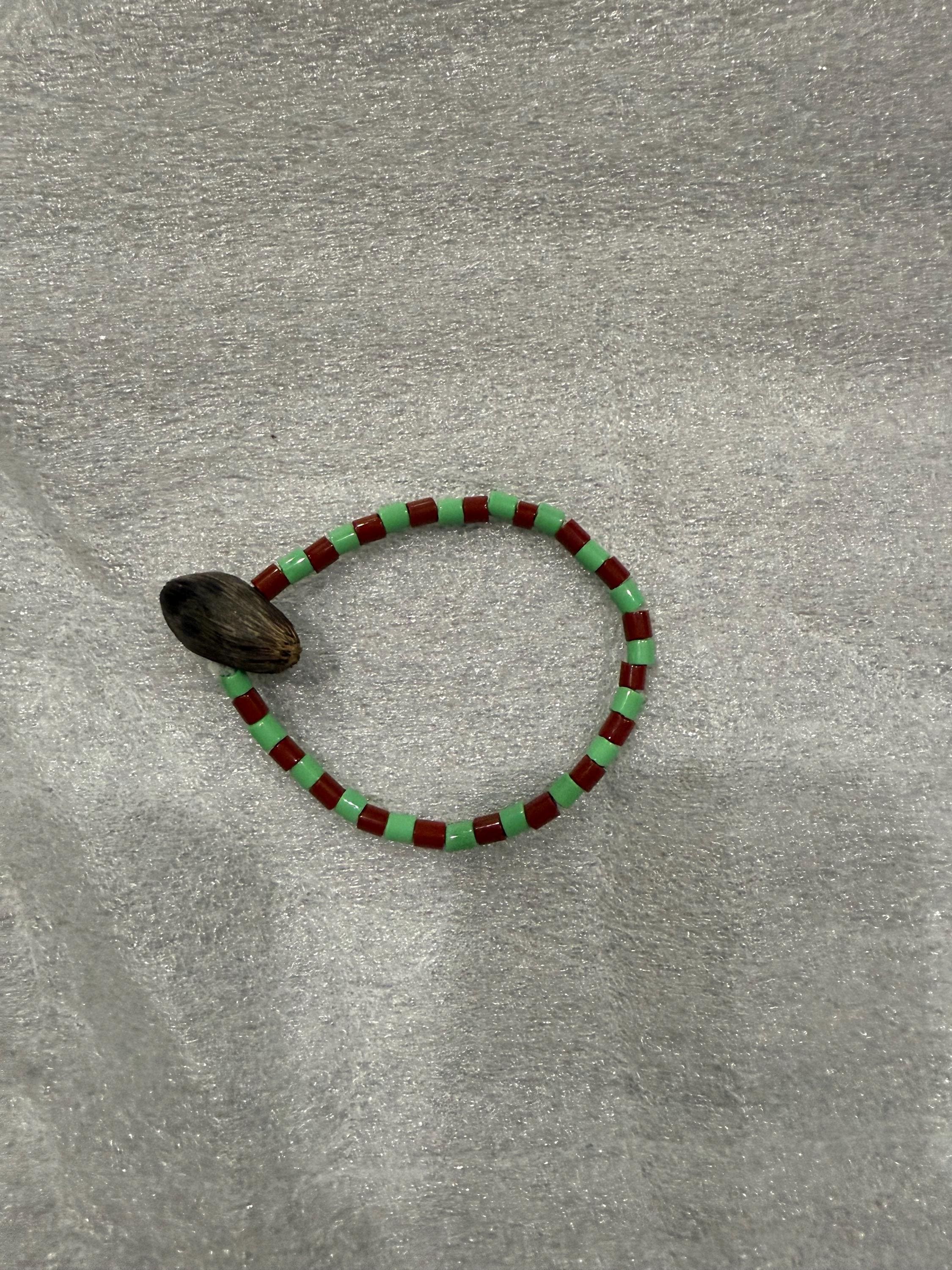 Ide de Orula Orunmila con ikin 4 ojos