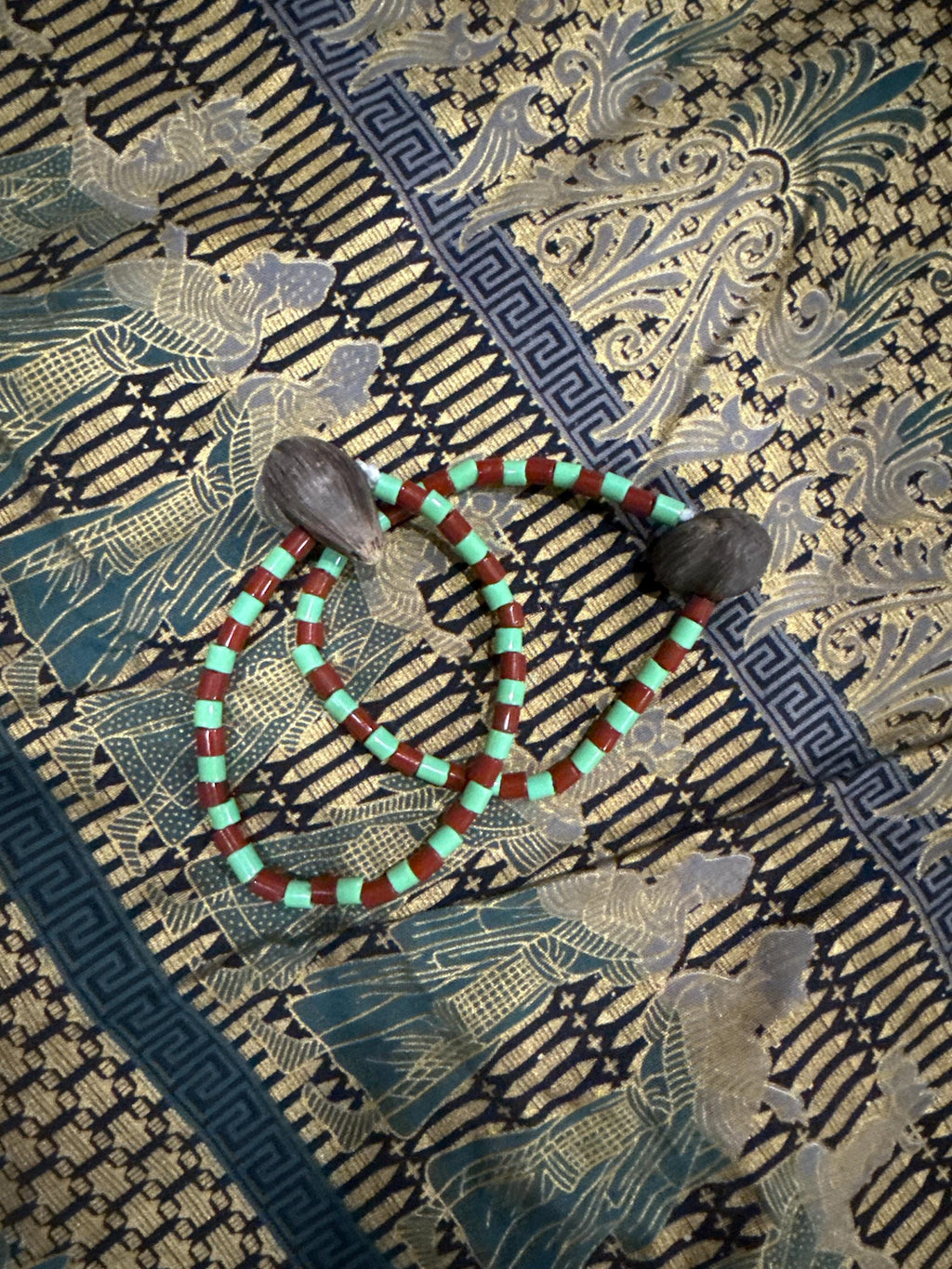 Ide de Orula Orunmila con ikin 4 ojos