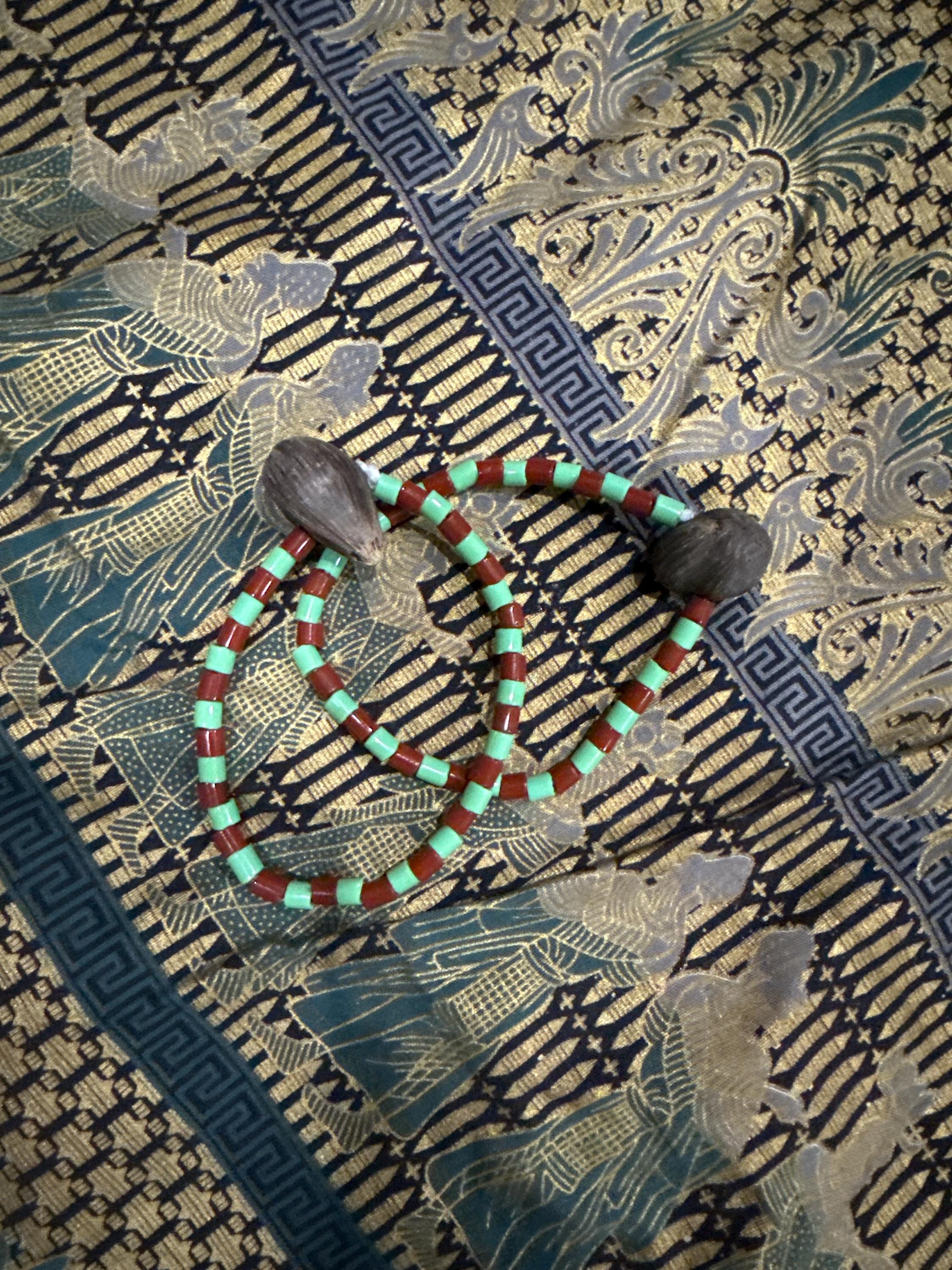 Ide de Orula Orunmila con ikin 4 ojos